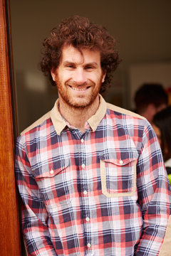 Portrait Of Man Leaning In Doorway