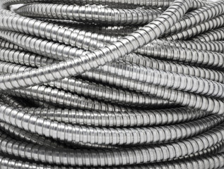 Flexible metal pipe on a white background.