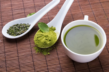Green tea on the brown mat