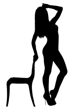 Silhouette of a woman dancing near the chair