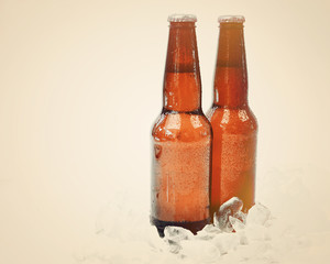 Cold Retro Beer Bottles on Ice with Copyspace