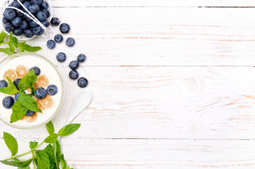 Yogurt with muesli and blueberries.