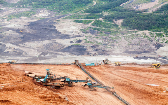 Part of a pit with big mining truck working