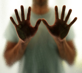 Man behind the glass, isolation and loneliness