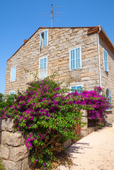 Old stone living house facade, Figari town