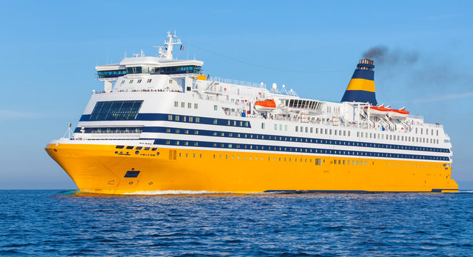 Yellow passenger ferry goes on the Sea
