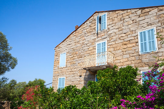 Old stone living house facade fragment, Figari