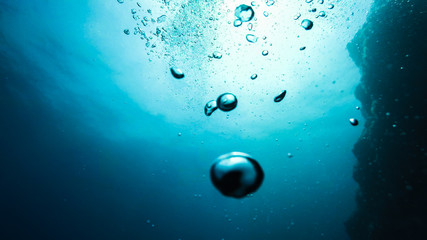  bubbles in water on a blue background, underwater photography
