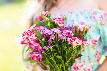 beautiful girl with a bouquet of flowers
