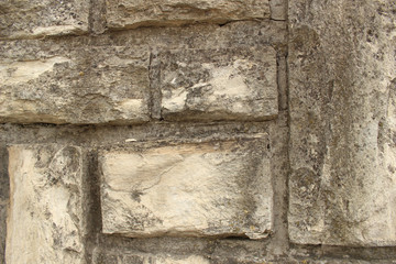 a wall lined with gray stone