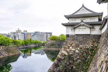 Fototapeta na wymiar The impressive stone wall of Osaka castle, Japan