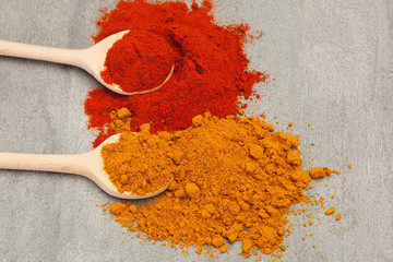 Colorful spices over wooden table