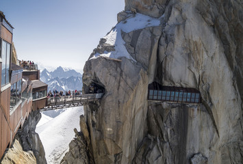 Amazing suspension footbridge between tho peaks on Aiguille du Midi,3842m, Mont Blanc Massif, France .