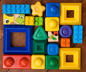 Creative plastic toys on a wooden base