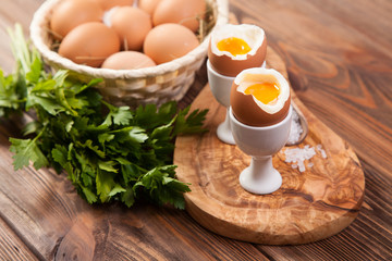 Boiled eggs on a wooden background