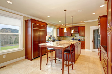 State of the art kitchen with tall island.