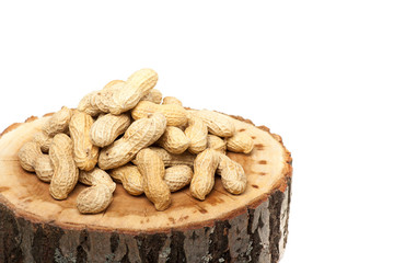 Pile of unshelled peanuts, isolated on white background
