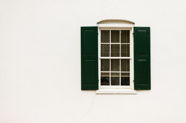 White Window with Green Shutters