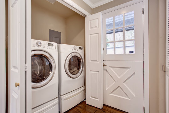 Small laundry area with washer and dryer.