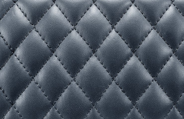 black leather background with stitching