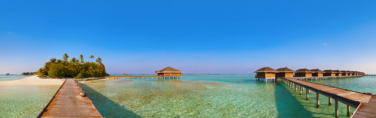 Bungalows on tropical Maldives island