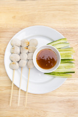 pork meat ball grilled and sauce on wood background