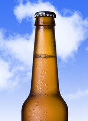 macro beer golden bottle neck with frost and bubbles in brown glass 