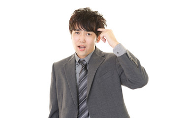 がっかりした表情のビジネスマン