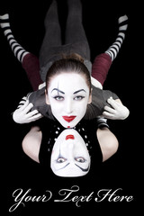 two mimes on black background