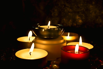 group of candles against a dark background