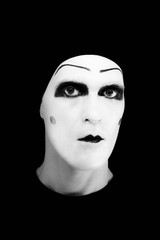 cheerful mime in white gloves