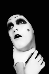 mime with hands on a neck