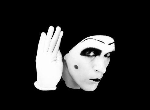 Portrait of  overhearing mime in white gloves