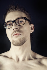 portrait of a young man in glasses