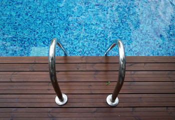 Chrome ladder into swimming pool