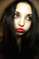 sad girl with dark blue eyes