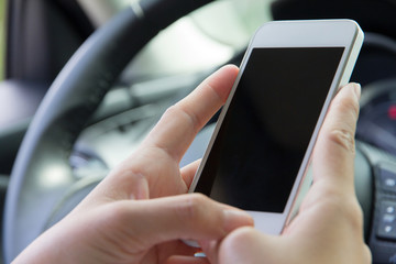 Woman Sitting in the Car and Using Smart Phone