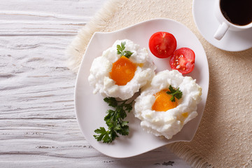 Breakfast aristocrat: eggs Orsini and coffee horizontal  top view
