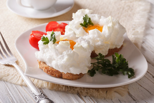 Toasts baked with whipped egg whites and yolk close-up