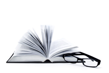 Opened book and glasses