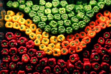 red green yellow orand and red peppers on display