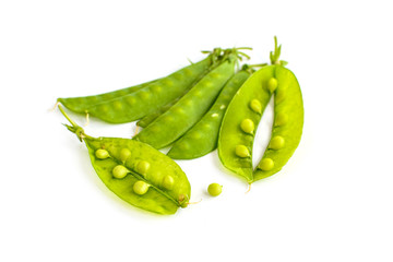 young fresh pods of green peas isolated on white background