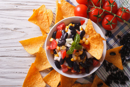 Mexican Salsa  With Beans And Corn Chips Nachos. Horizontal Top View
