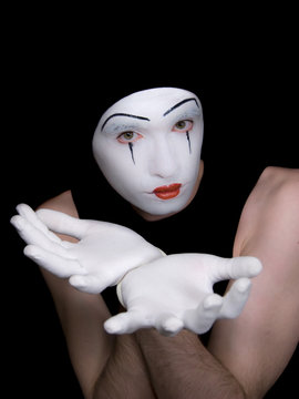 mime in white gloves