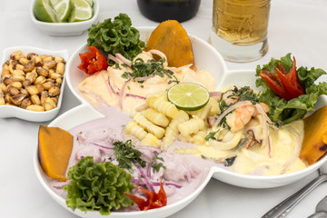 Peru Dish: 3 types of Cebiche (ceviche), chicha drink, canchita.
