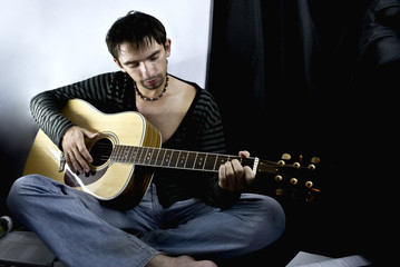Obraz premium young man with a guitar