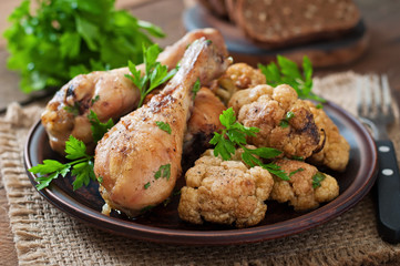Chicken leg with baked cauliflower and parsley