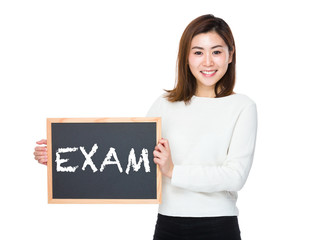 Asian woman with chalkboard and showing a word exam