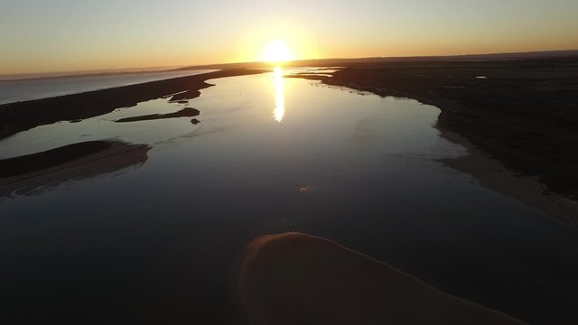 Aerial footage images and elevated view of river murray mouth in coorong on dusk. Famous place for coorong sandhills, sand dunes, wetlands, fishing and and boating in South Australia