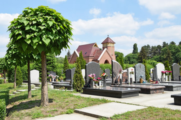Tombstones and a chapel in the public cemetery